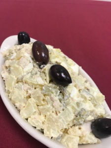 Diced chicken, eggs, potato, pickles and peas mixed with olive oil and mayonnaise